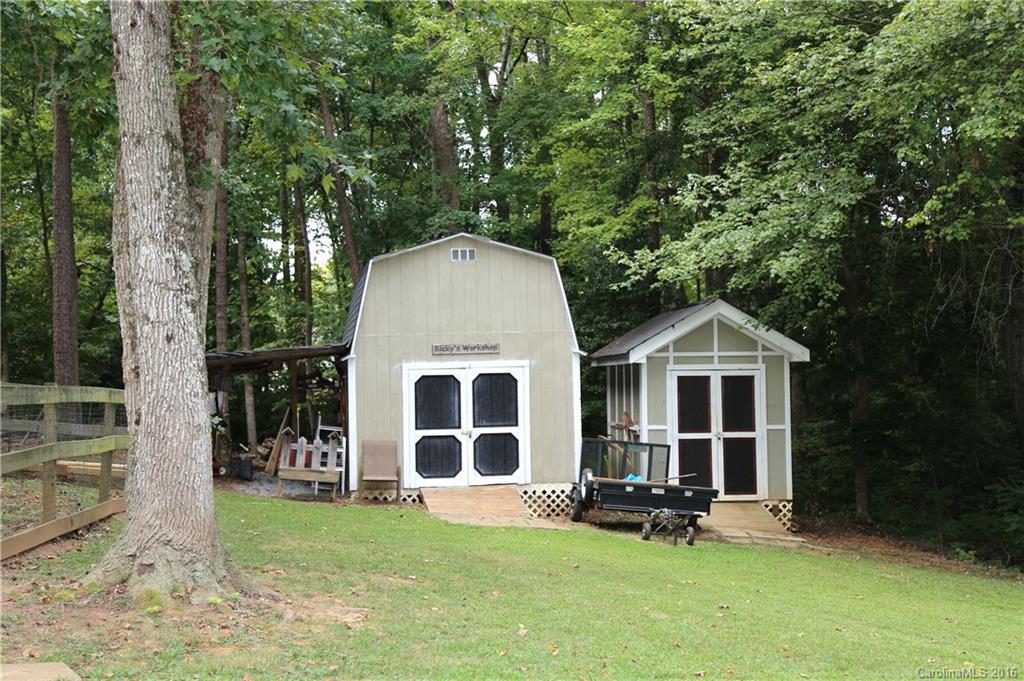 113 Sawtooth Lane, Unit 27 Stanley, NC 28164 - Photo 24 of 24 a view of a house with a yard and sitting area