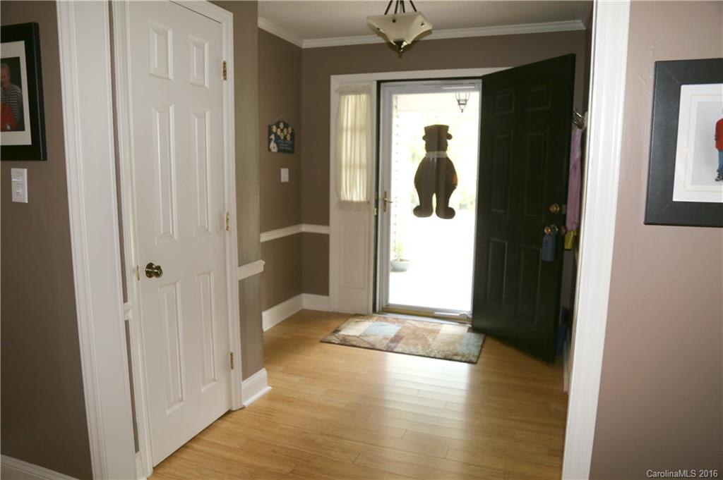 113 Sawtooth Lane, Unit 27 Stanley, NC 28164 - Photo 4 of 24 a view of a hallway with wooden floor