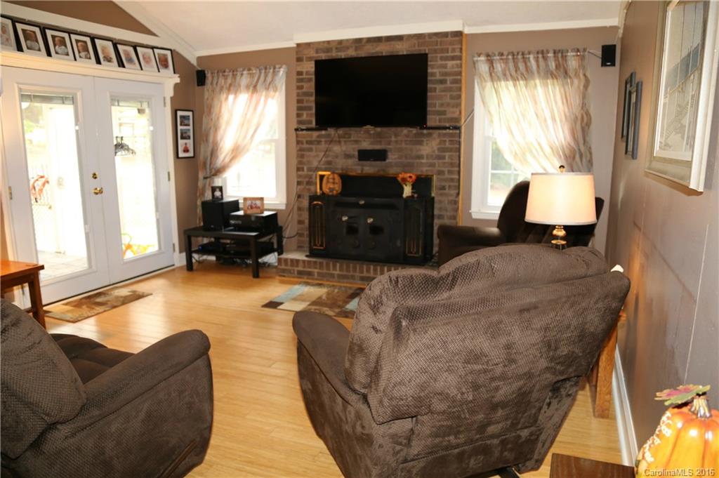 113 Sawtooth Lane, Unit 27 Stanley, NC 28164 - Photo 5 of 24 a living room with furniture and a flat screen tv