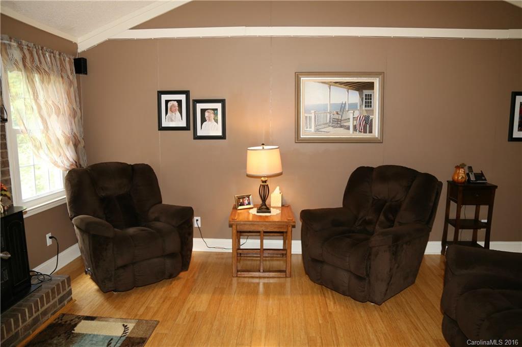 113 Sawtooth Lane, Unit 27 Stanley, NC 28164 - Photo 6 of 24 a living room with furniture lamp and window