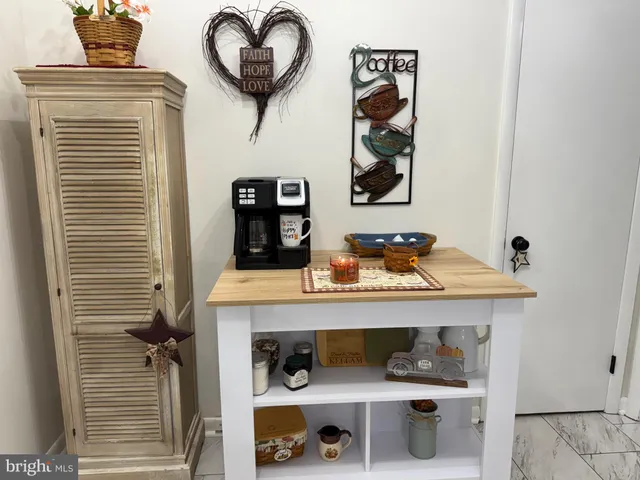 a view of a hallway with cabinet