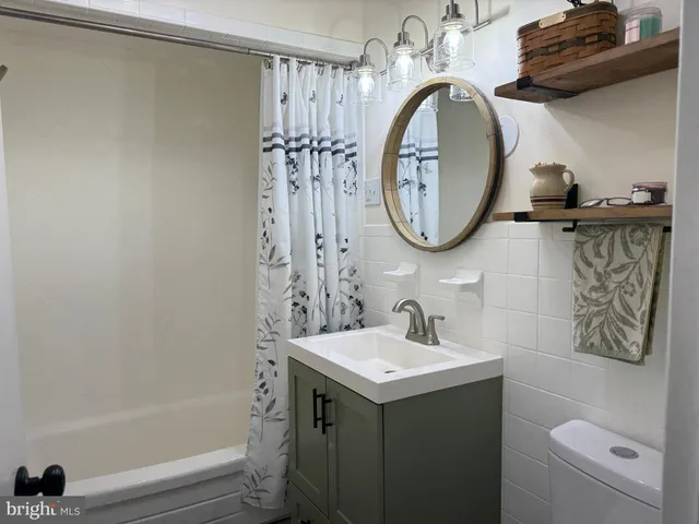 a bathroom with a bathtub and shower