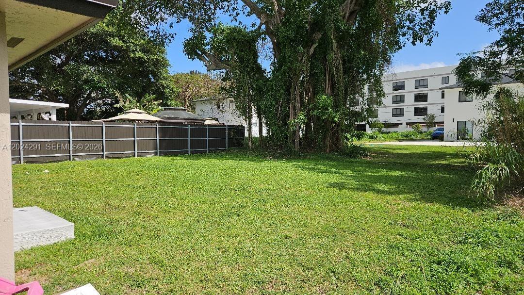 11970 Southwest 217th Street Miami, FL 33170 - Photo 2 of 10 a view of a house with a yard and sitting area