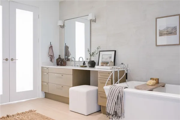 a room with a sink and a mirror