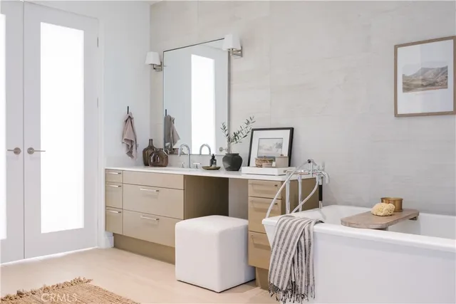 a room with a sink and a mirror