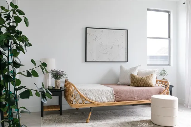 a view of a lake with couches and chairs