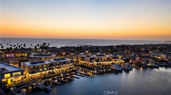 an aerial view of a town with ocean view