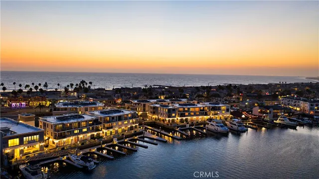 an aerial view of a town with ocean view