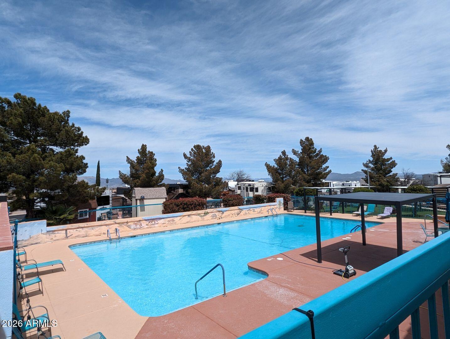 1030 Barrel Cactus Ridge, Unit 225 Benson, AZ 85602 - Photo 11 of 15 a view of a swimming pool with seating area