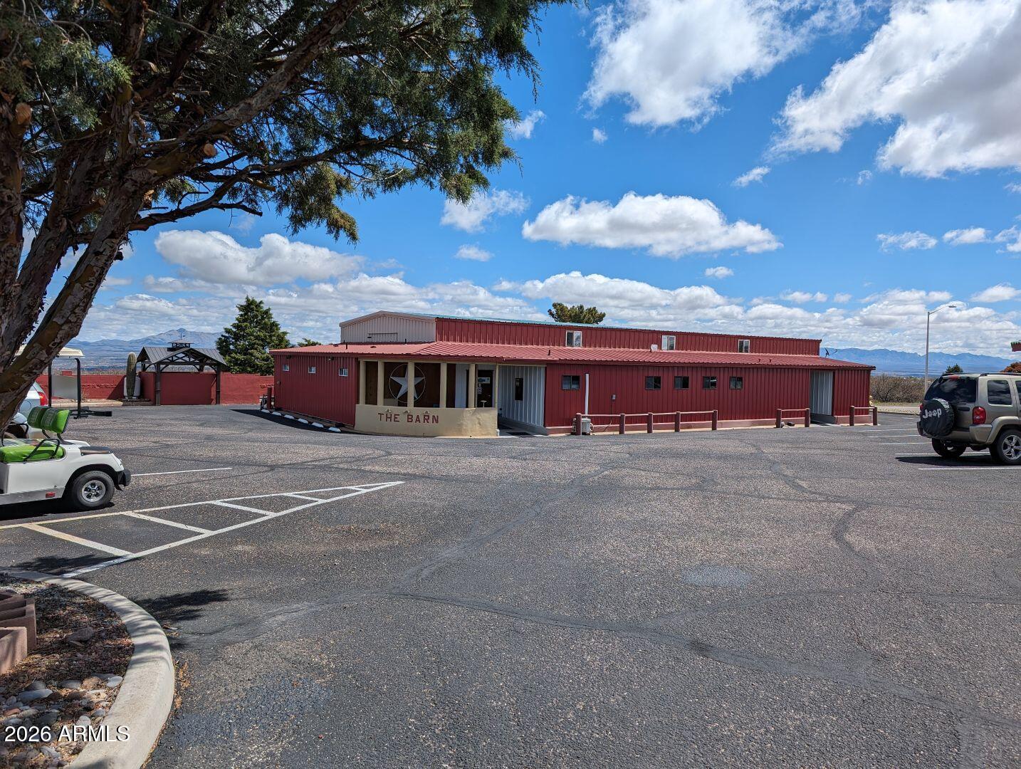 1030 Barrel Cactus Ridge, Unit 225 Benson, AZ 85602 - Photo 13 of 15 a view of a car parked in front of a house