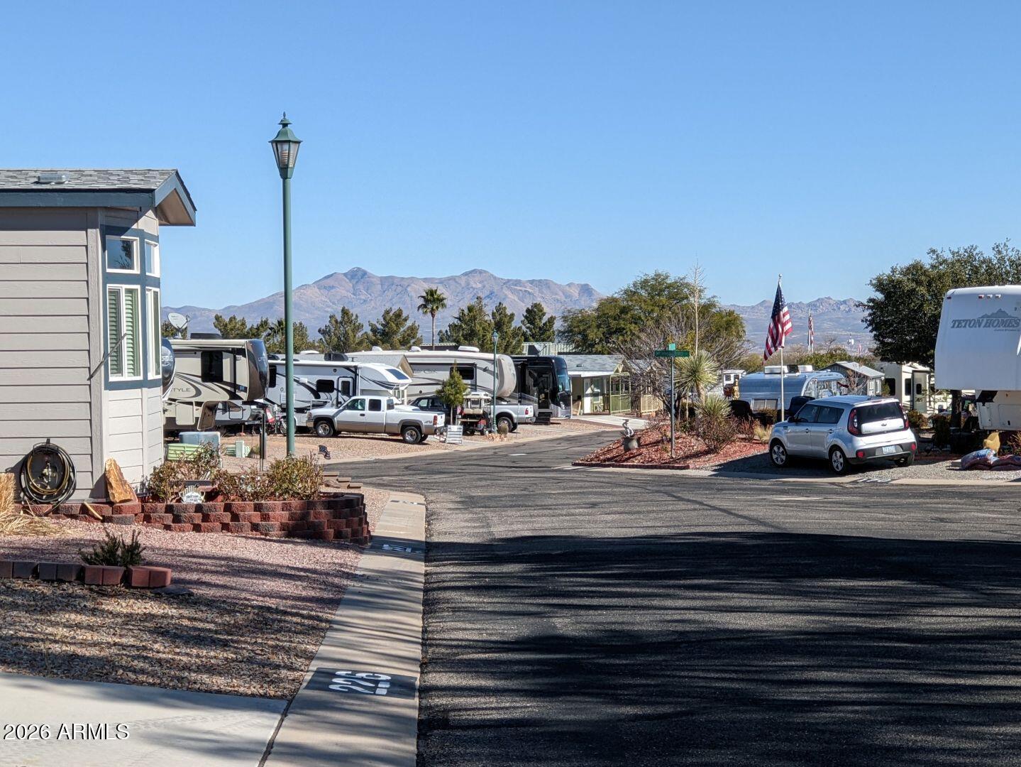 1030 Barrel Cactus Ridge, Unit 225 Benson, AZ 85602 - Photo 15 of 15 a view of a terrace with a bench and mountain view