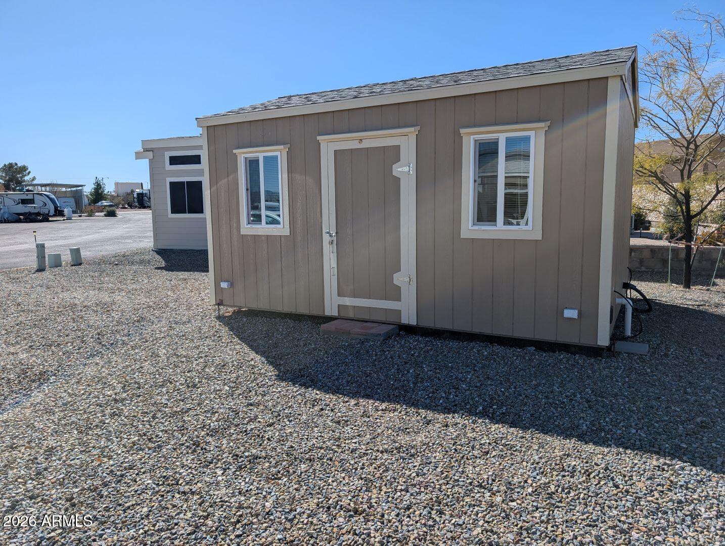 1030 Barrel Cactus Ridge, Unit 225 Benson, AZ 85602 - Photo 3 of 15 a view of a house with a yard