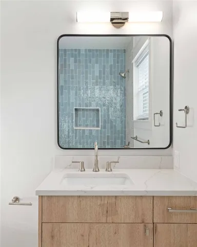 a bathroom with a sink and a mirror