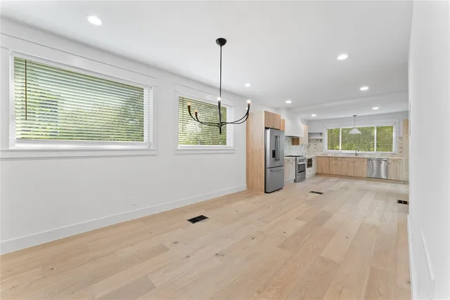 a view of an empty room with a window