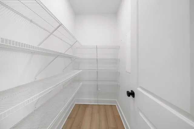 a spacious bathroom with a double vanity sink mirror and toilet