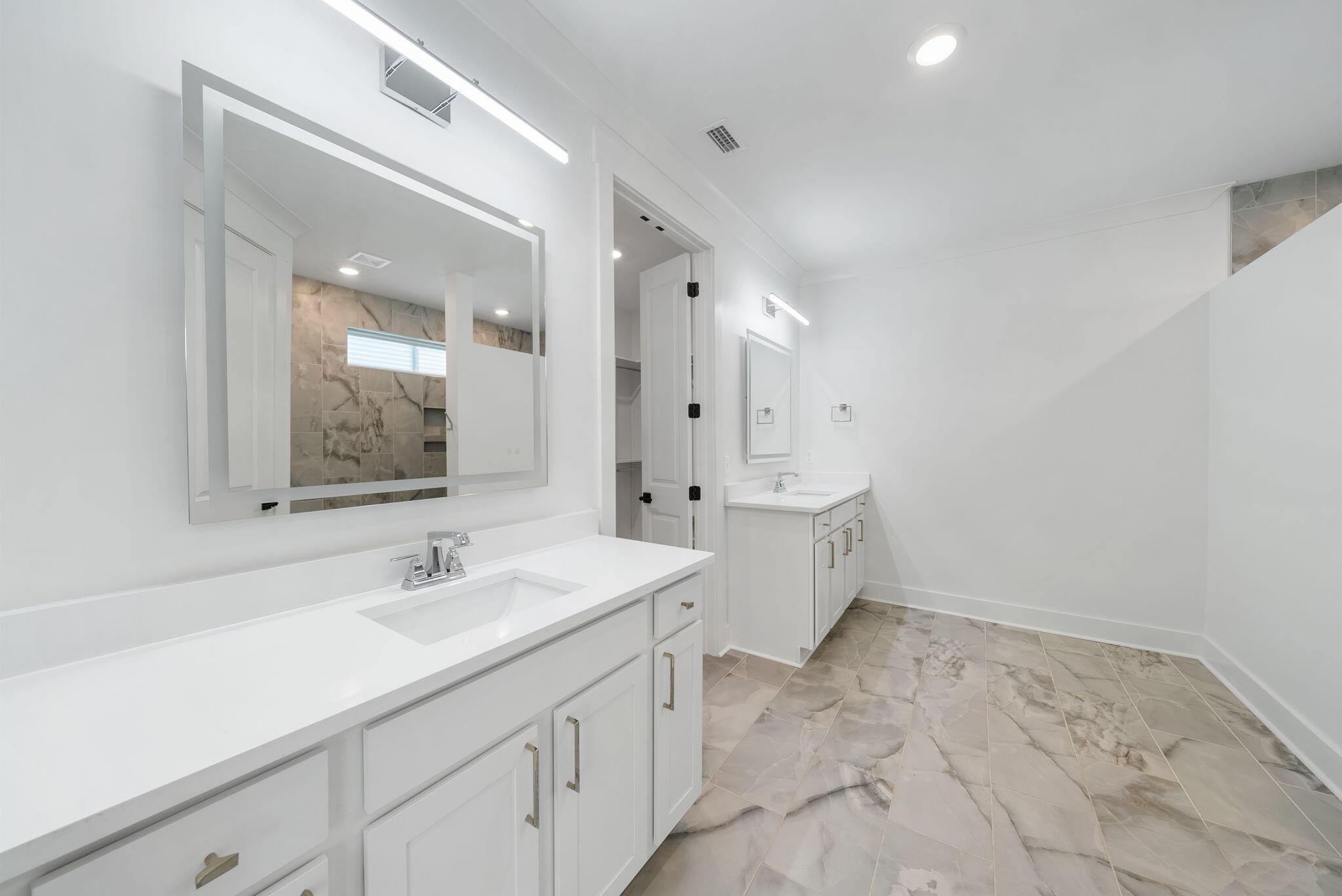 1917 Rushes Avenue Panama City, FL 32405 - Photo 20 of 66 a spacious bathroom with a double vanity sink mirror and toilet