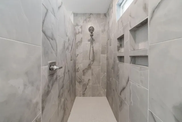 a view of an empty room and a window