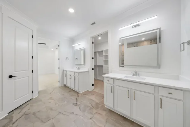 a bedroom with a bed and a chair