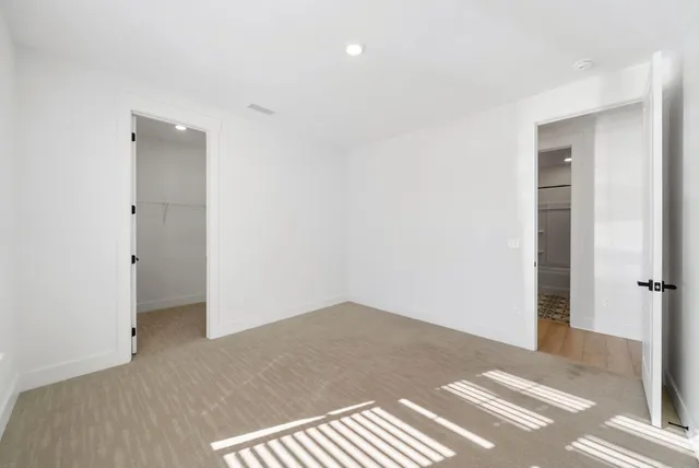 an empty room with a empty space and a window