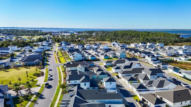 an aerial view of residential houses with outdoor space
