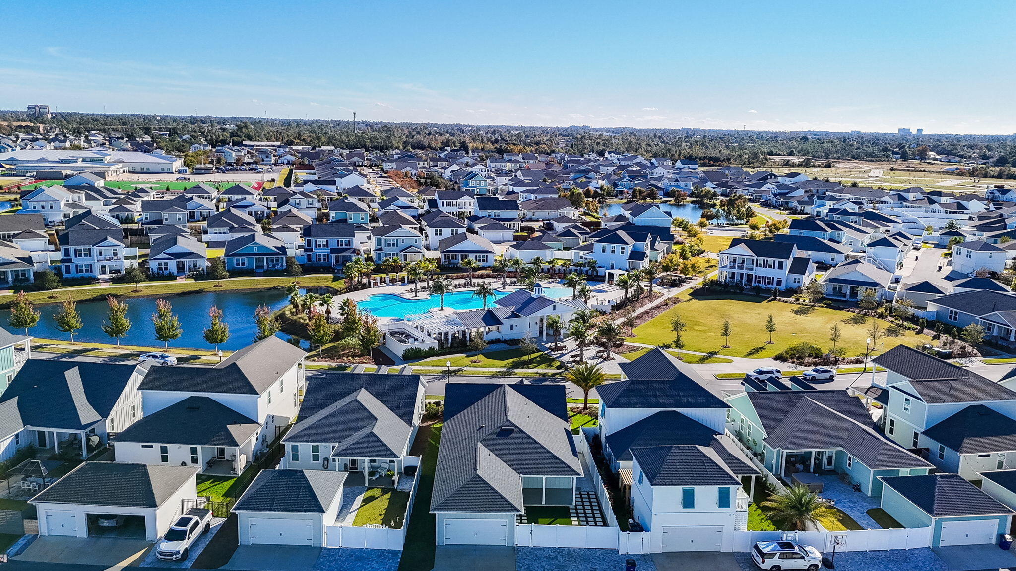 1917 Rushes Avenue Panama City, FL 32405 - Photo 52 of 66 a view of a swimming pool with outdoor seating and a garden