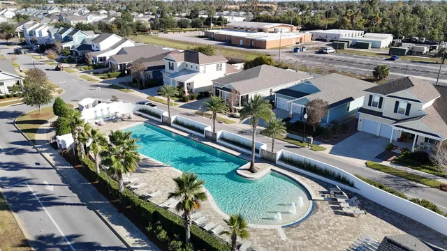 an aerial view of residential houses with outdoor space