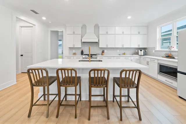 a view with a sink and chandelier