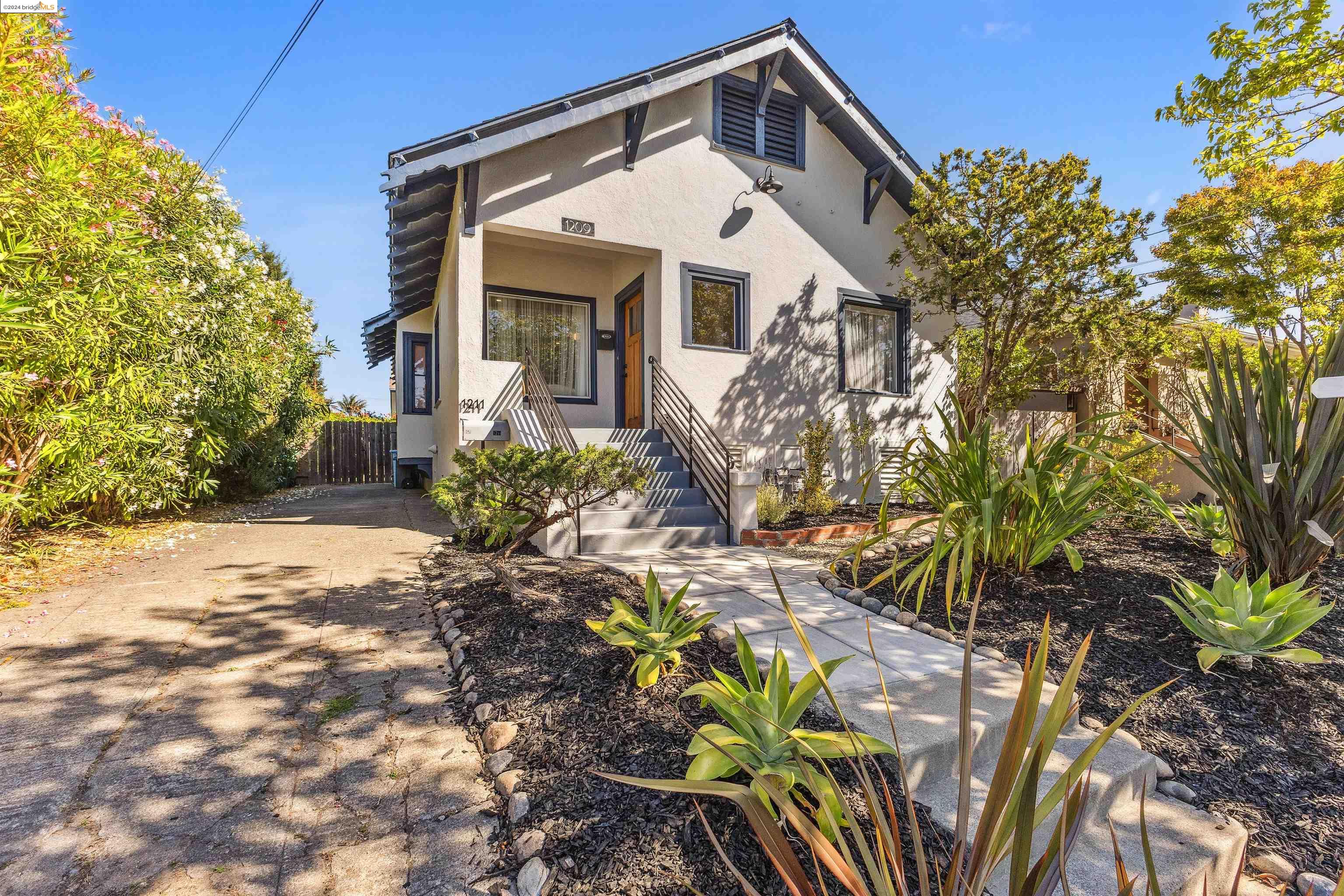 1209 Delaware Street Berkeley, CA 94702 - Photo 1 of 1 a front view of a house with a yard