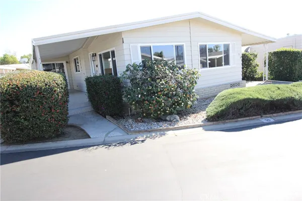 a view of a front of a house with a yard