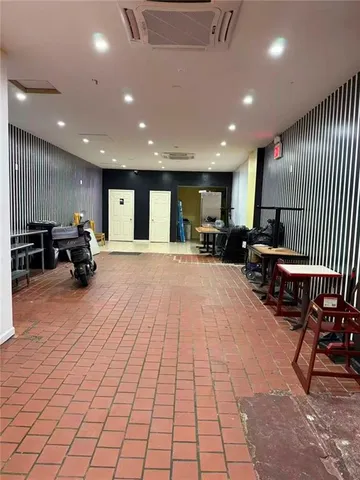 a large room with gym equipment