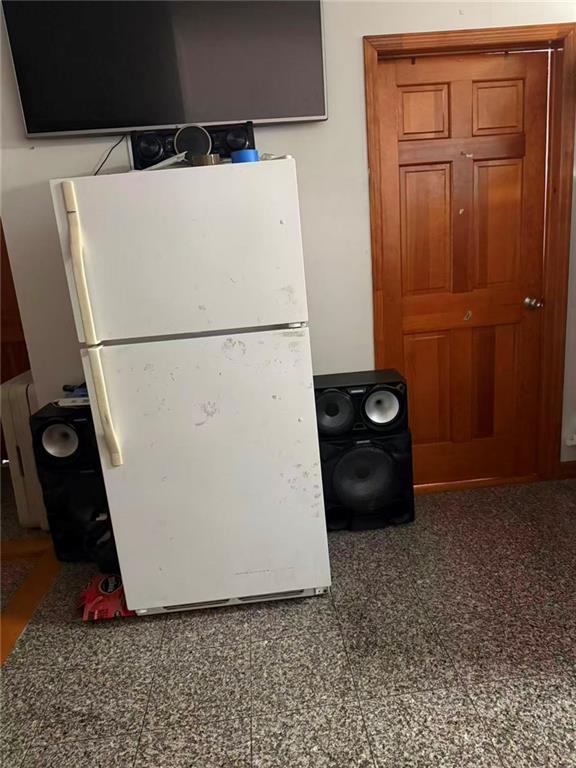 7404 3rd Avenue Brooklyn, NY 11209 - Photo 7 of 9 a white refrigerator freezer sitting in a kitchen