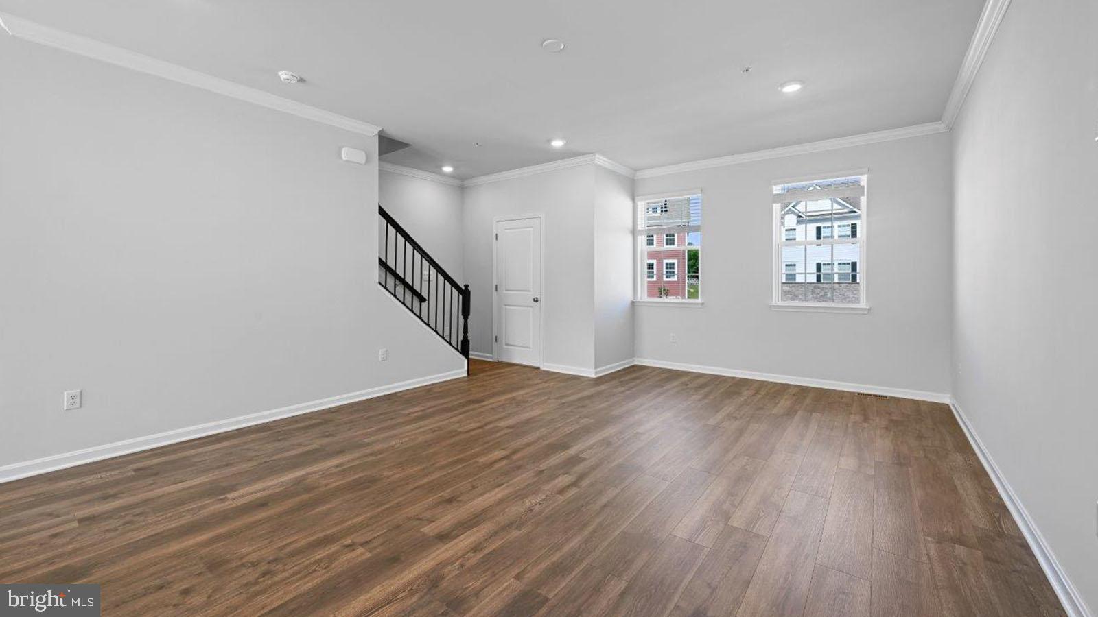 5046 Silver Oak Drive Rosedale, MD 21237 - Photo 7 of 21 a view of an empty room with wooden floor and a window