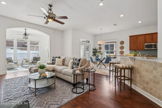 a dining room with furniture and window