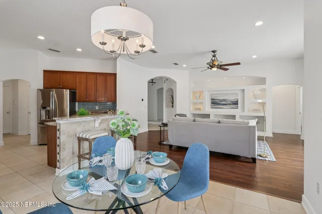 a bathroom with a sink a vanity a mirror and a toilet