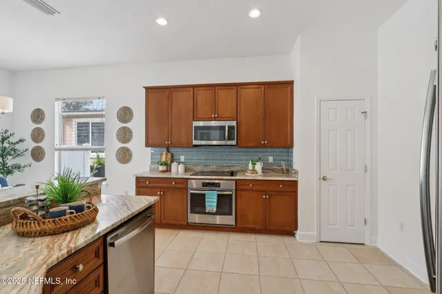 a living room with furniture or kitchen view and a wooden floor