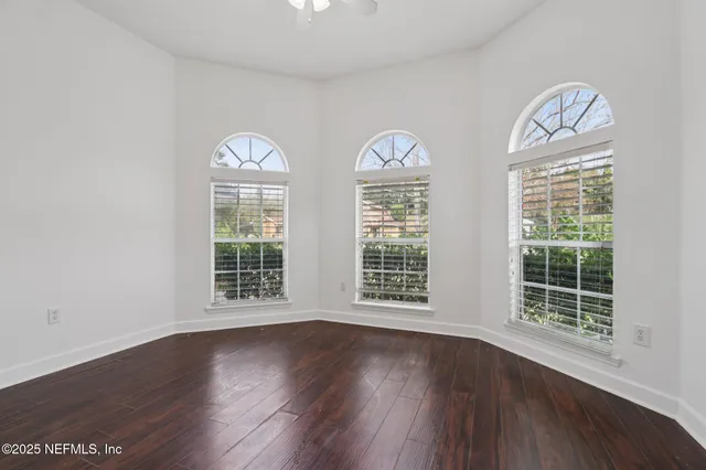 a view of a house with swimming pool and sitting area