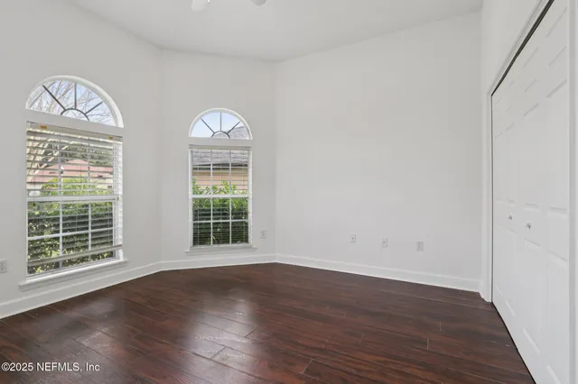 a view of a house with pool fire pit and chairs