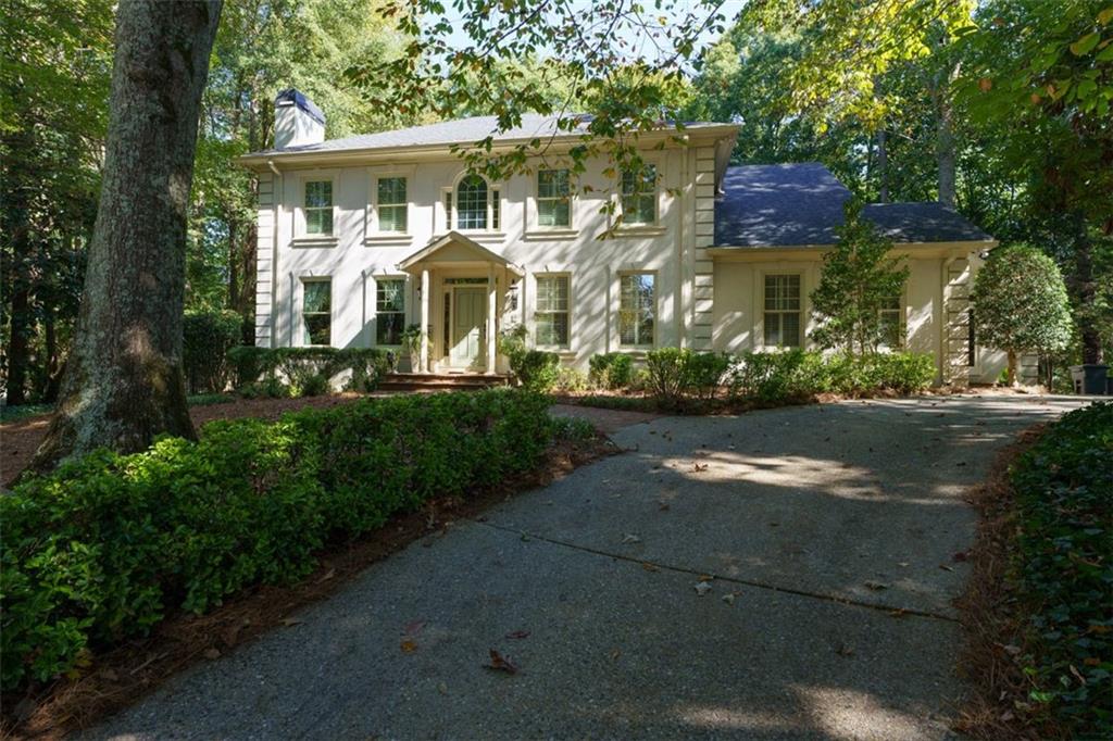 31 Burdette Road Northwest Sandy Springs, GA 30327 - Photo 1 of 1 a front view of house with yard and green space