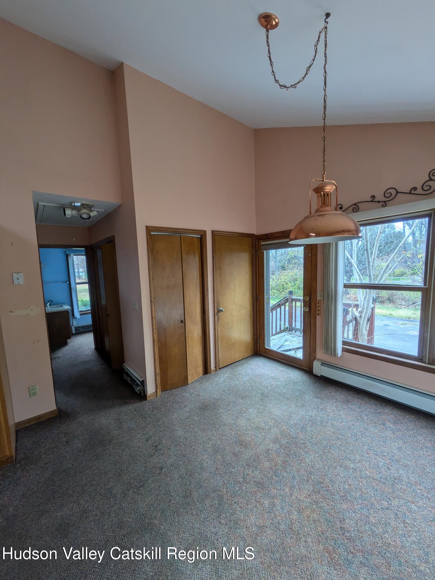 15 Valk Road Saugerties, NY 12477 - Photo 11 of 35 a view of a room with windows and chandelier