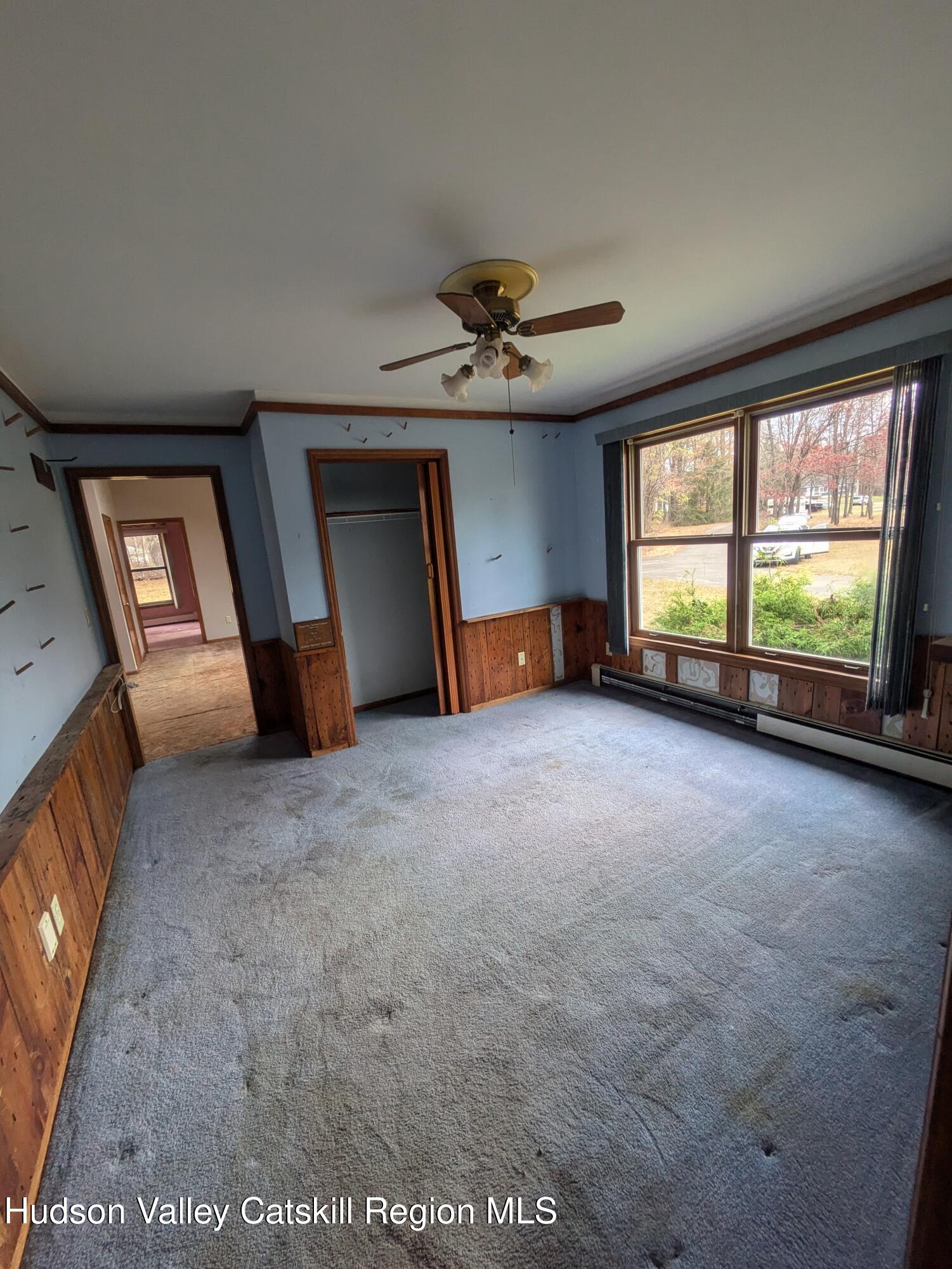 15 Valk Road Saugerties, NY 12477 - Photo 13 of 35 a view of a livingroom with an empty space and a fireplace