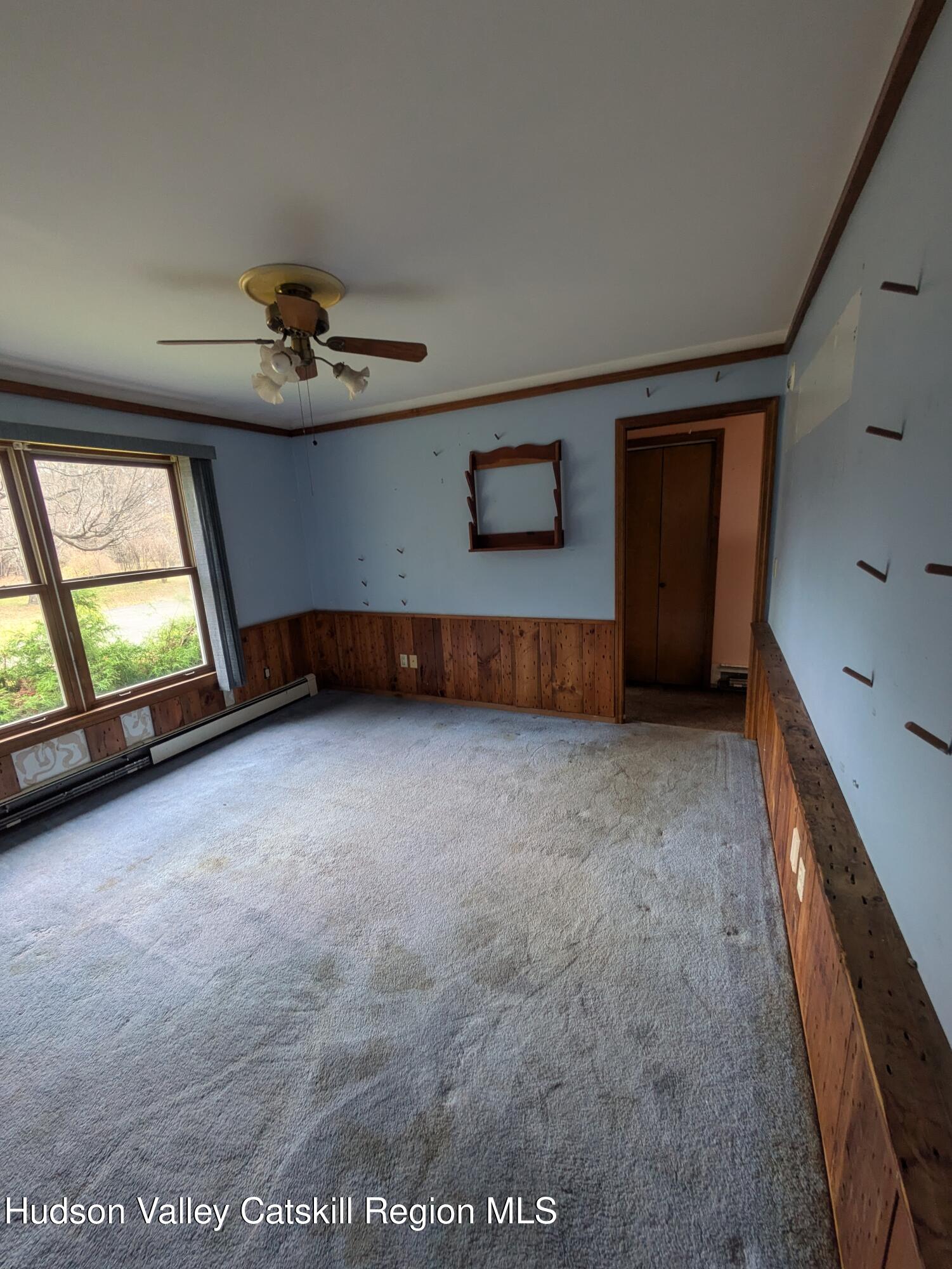 15 Valk Road Saugerties, NY 12477 - Photo 14 of 35 wooden floor in an empty room with a window