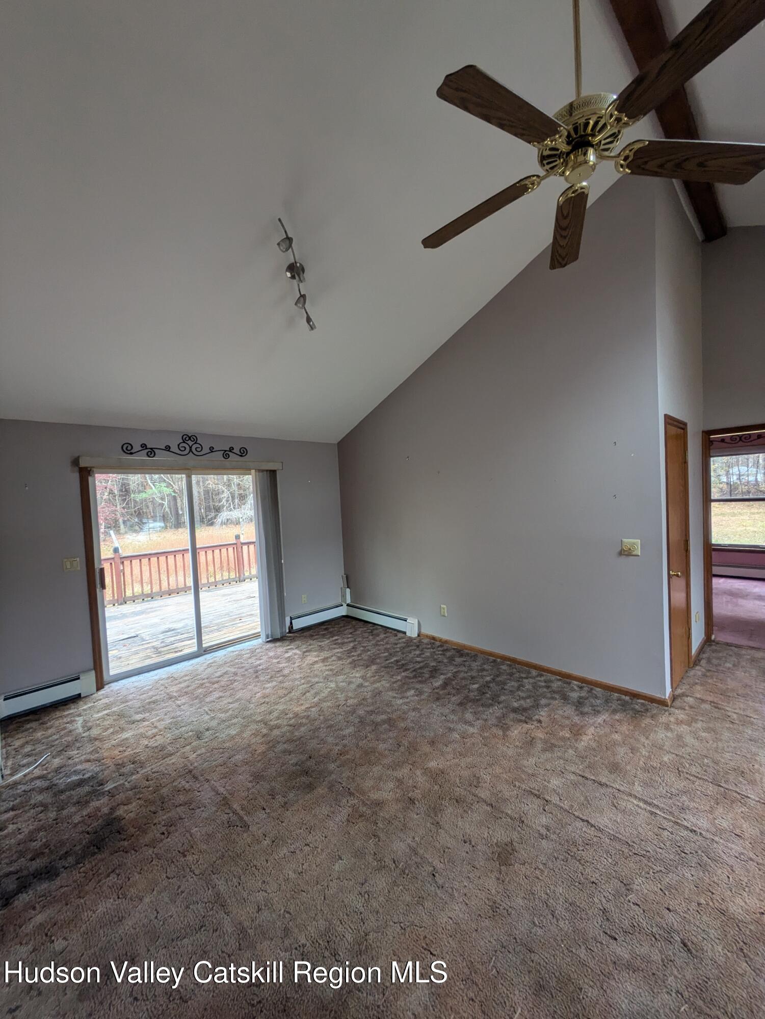 15 Valk Road Saugerties, NY 12477 - Photo 18 of 35 an empty room with windows and ceiling fan