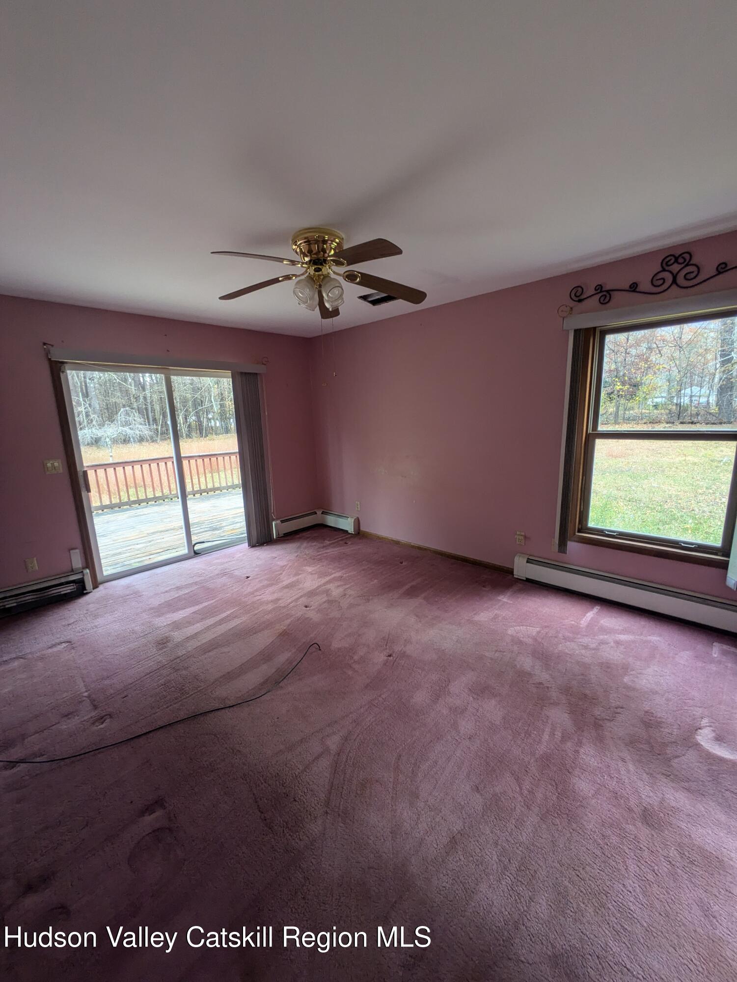 15 Valk Road Saugerties, NY 12477 - Photo 20 of 35 an empty room with windows and ceiling fan