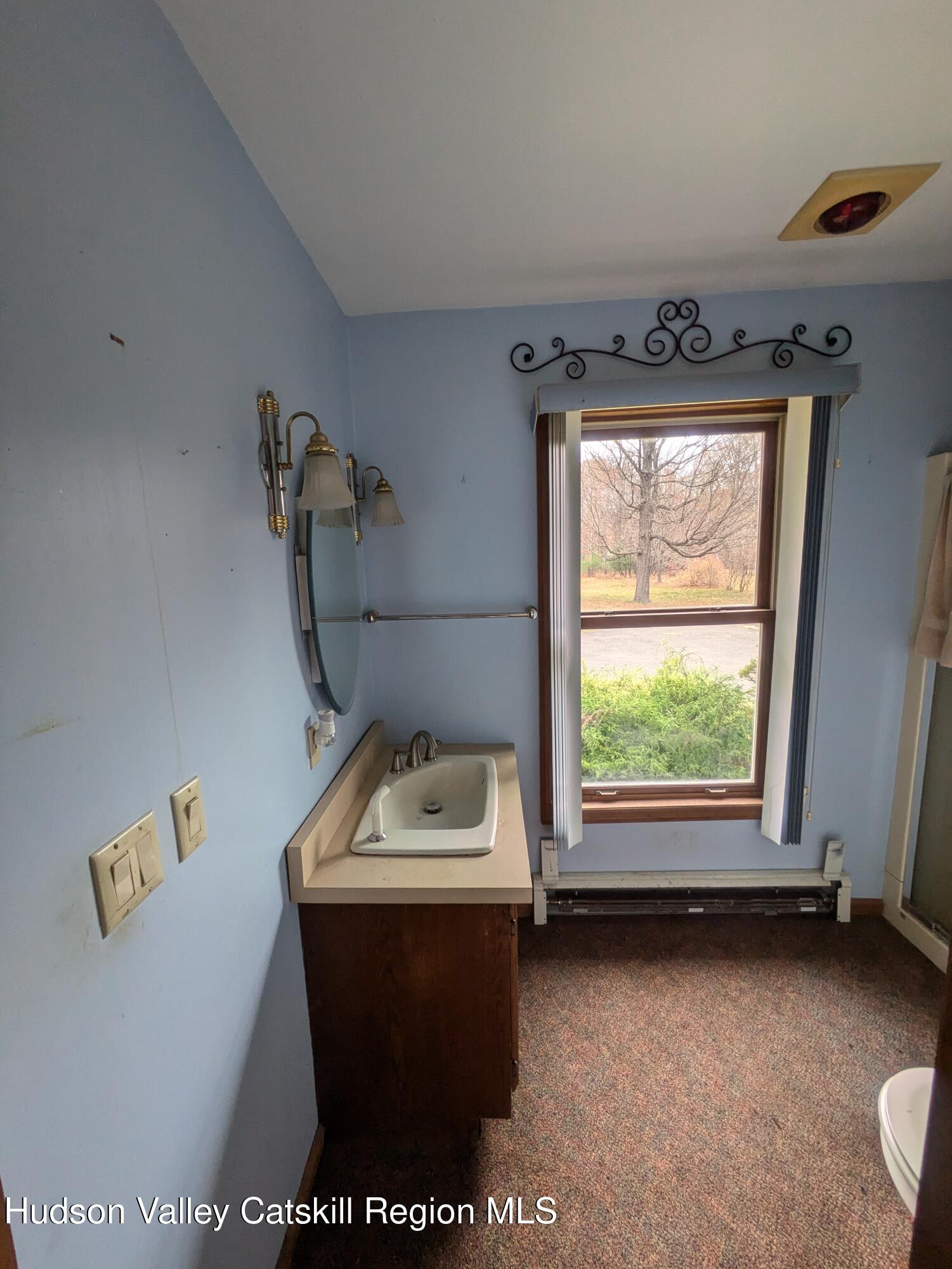 15 Valk Road Saugerties, NY 12477 - Photo 28 of 35 a room with a window and a projector screen