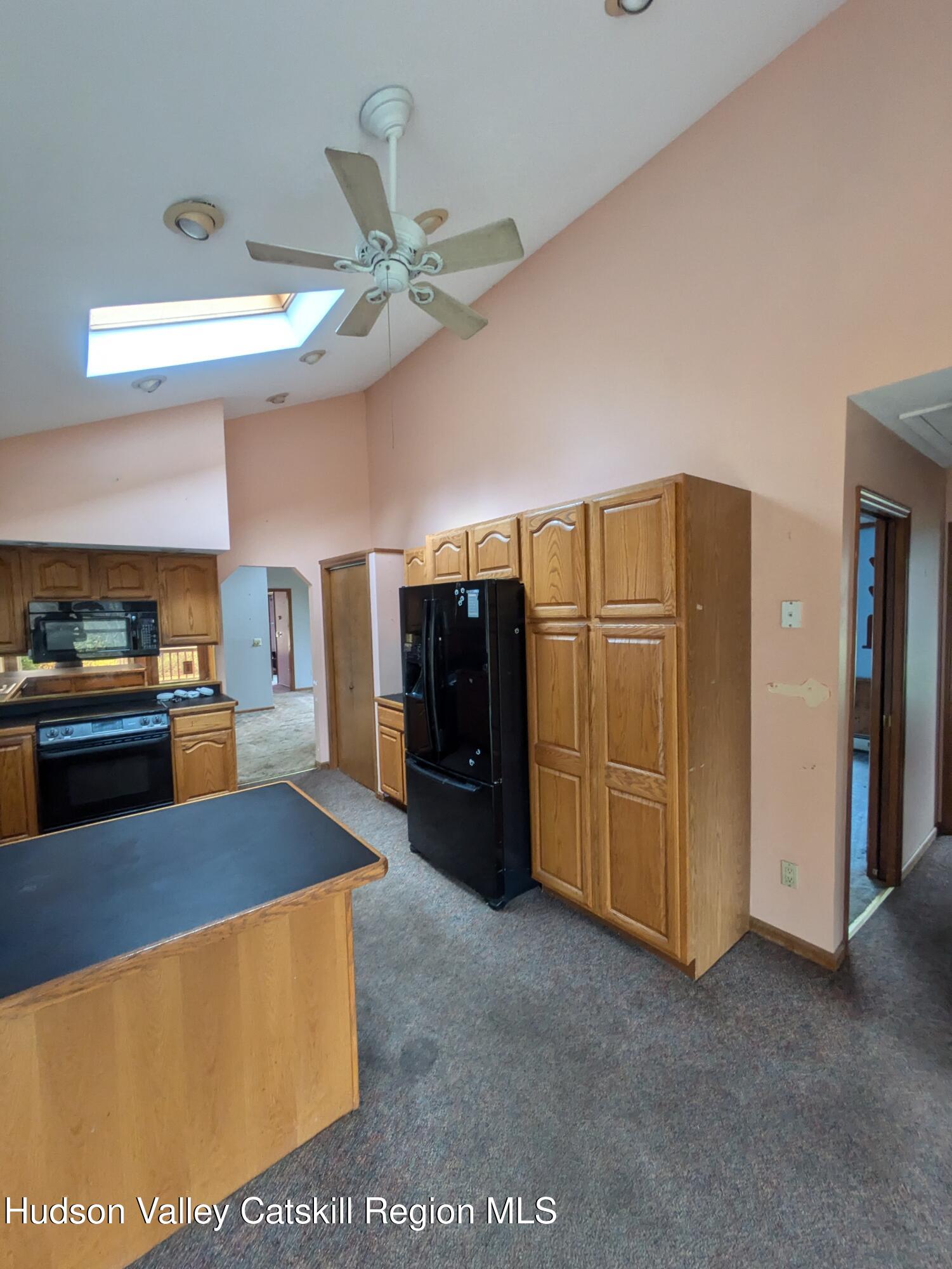 15 Valk Road Saugerties, NY 12477 - Photo 9 of 35 a large kitchen with stainless steel appliances granite countertop a refrigerator and a stove top oven