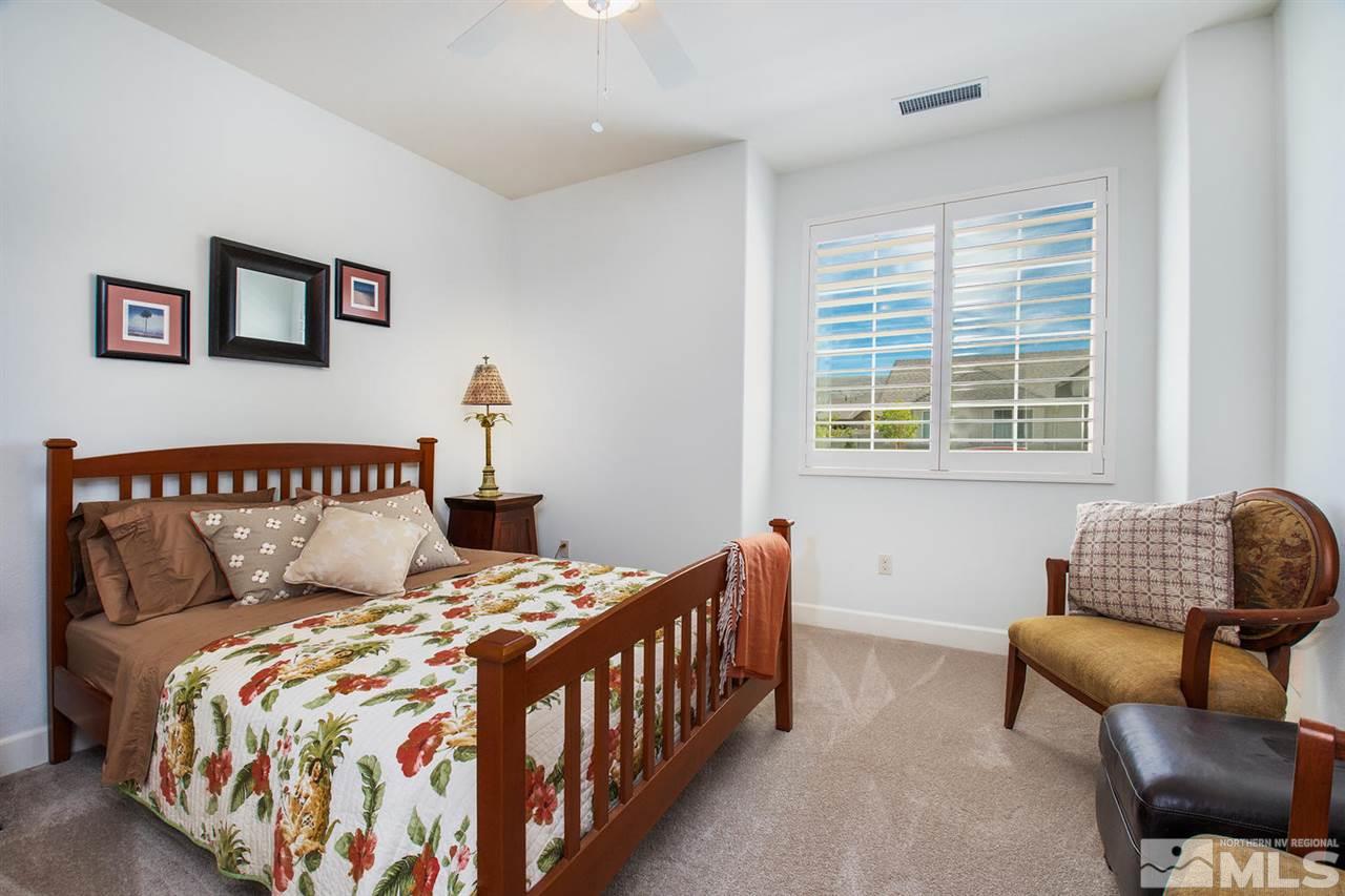 9645 Abigail Way Reno, NV 89521 - Photo 14 of 25 a bedroom with a bed and a couch