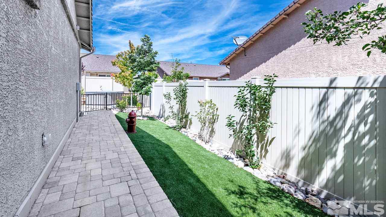 9645 Abigail Way Reno, NV 89521 - Photo 17 of 25 a view of a pathway with house on both side
