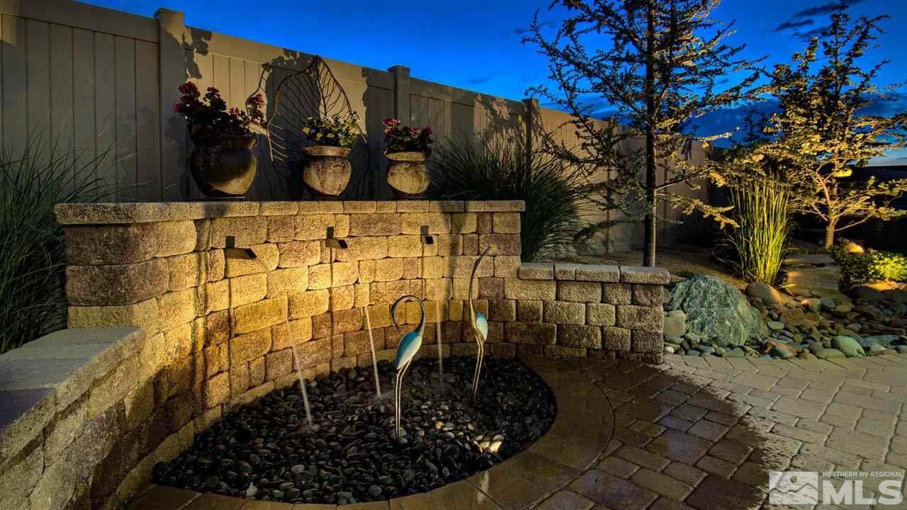 9645 Abigail Way Reno, NV 89521 - Photo 20 of 25 a view of a pathway covered with wooden fence