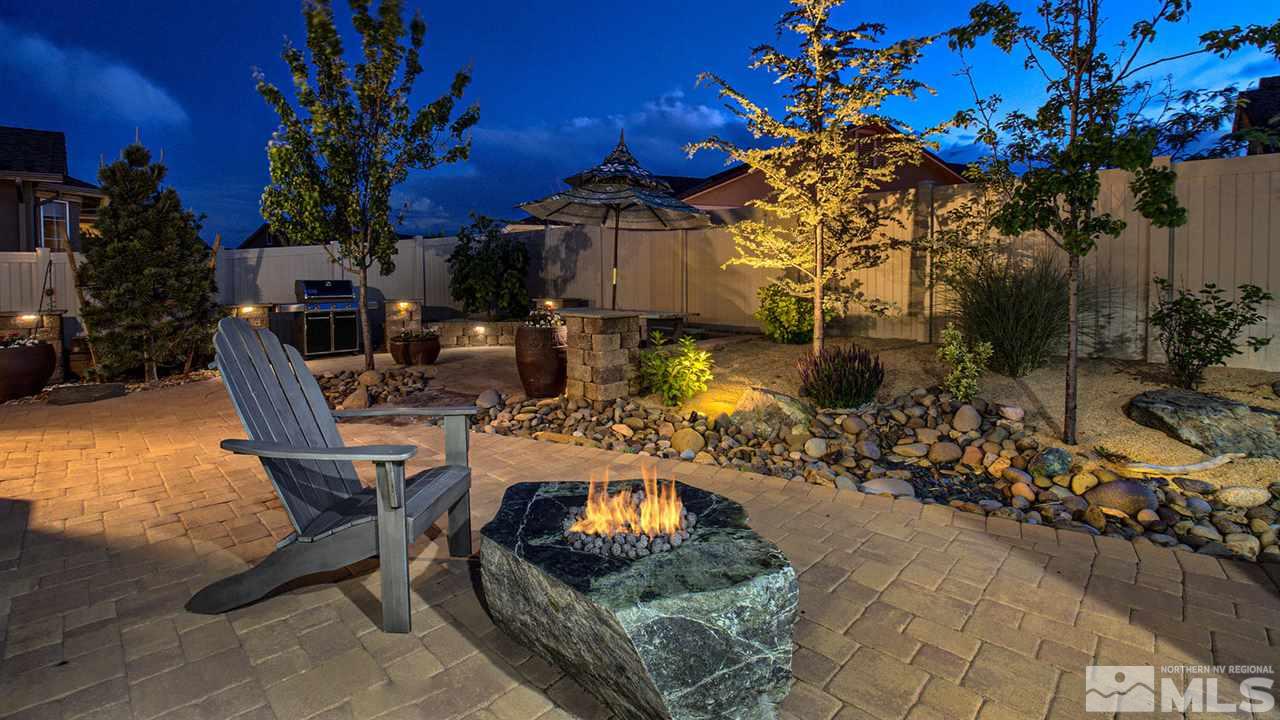 9645 Abigail Way Reno, NV 89521 - Photo 22 of 25 a view of a swimming pool with outdoor seating and plants