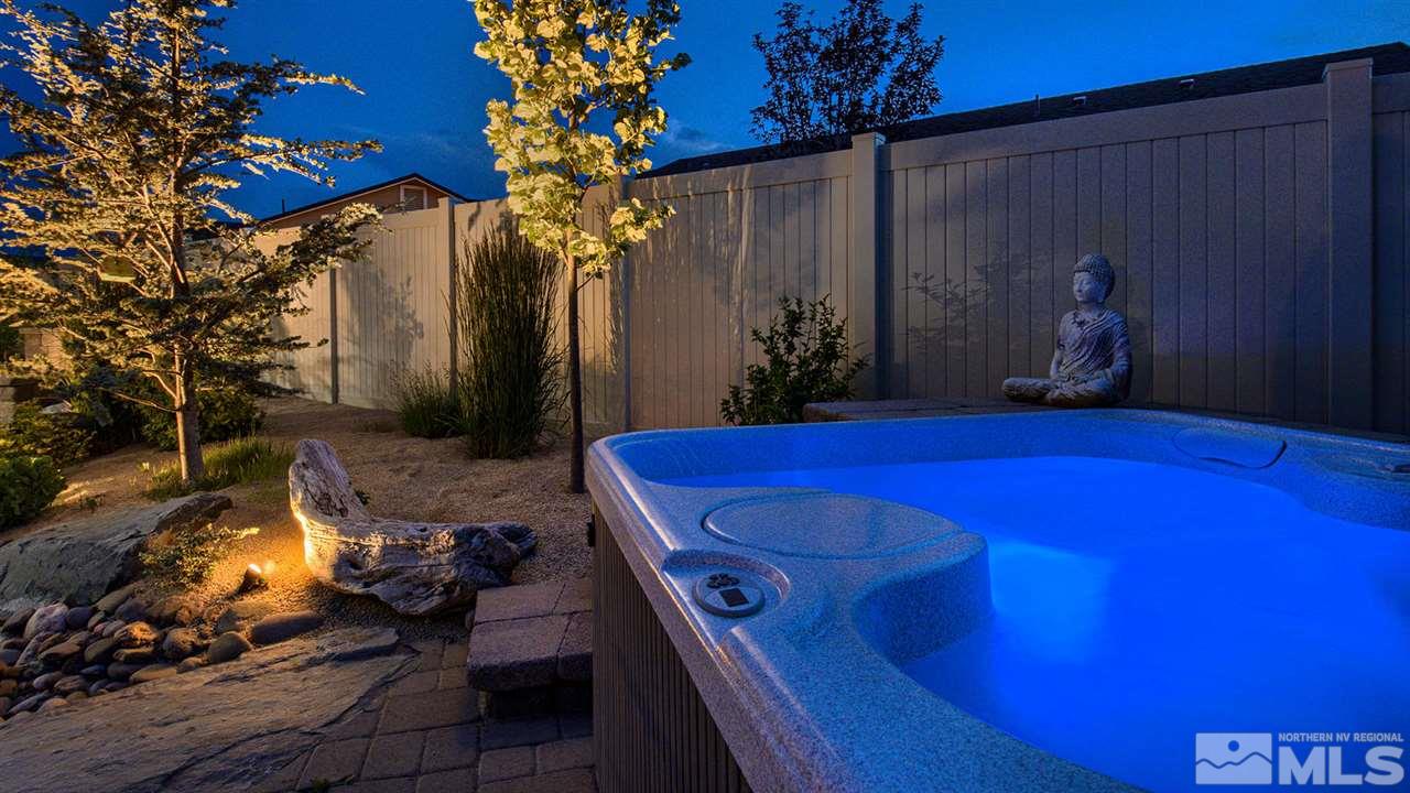 9645 Abigail Way Reno, NV 89521 - Photo 25 of 25 a view of a backyard with table and chairs with wooden fence
